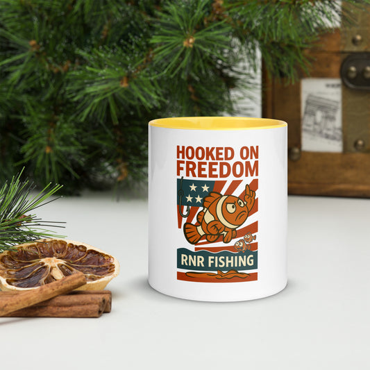 Hooked on Freedom patriotic fishing mug by RNR Fishing with red, white, and blue design

